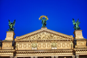 Neoclassical Building. A neoclassical building facade with sculptures under a blue sky, showcasing...