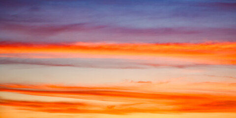 The sky ablaze with warm colors transitioning into cool tones, capturing nature’s artistry. Perfect for inspirational themes.