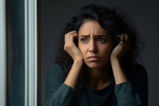 Stressed young hispanic woman suffering from negative thoughts
