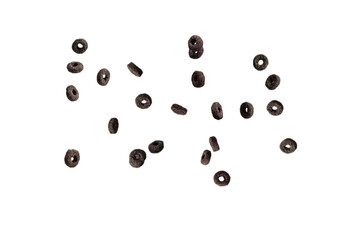 Chocolate rings cereal spill out into a bowl. Breakfast.