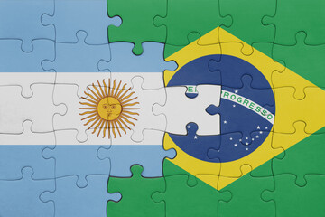 puzzle with the colourful national flag of brazil and flag of argentina.