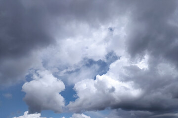 Clear blue sky texture and white fluffy cloud nature background. The sun shines bright in the daytime in summer