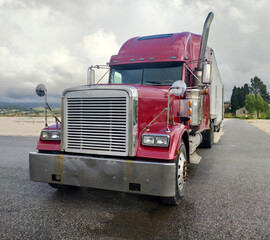 Red Semi Truck Parked on Side of Road