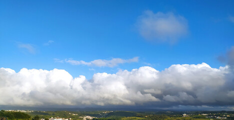 Obraz premium Clear blue sky texture and white fluffy cloud nature background. The sun shines bright in the daytime in summer