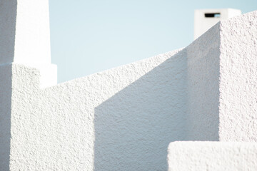 Minimalistic Background with an architectural part with a stone texture. White and blue shades....