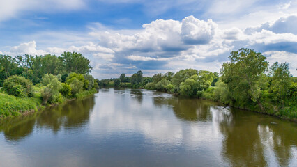 Aerial view of river in summer time. Beautiful natural scenery of river, drone view.