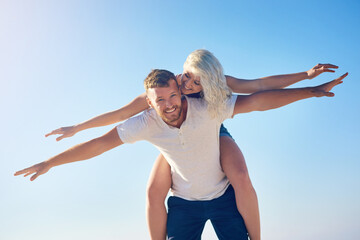 Couple, love outdoor for summer and happy piggyback, freedom or vacation adventure together. Care,...