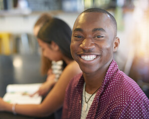 Portrait, man and students in cafe, smile and coffee shop for weekend break, lunch or conversation....