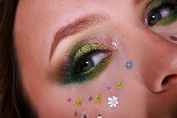 Spring beauty trendy makeup with vibrant green inspired by nature's blooms, perfect for a fresh...