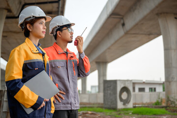 A male civil engineer and a female architect are seen carrying a laptop and a radio. Architects and...