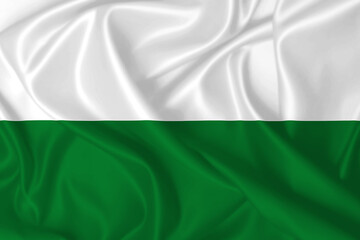 Obraz premium Flag of Styria and Saxony waving in the wind on silk texture