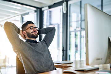 Businessman, stretching and relax at desk with computer, smile and break in office. Financial consultant, worker and rest with success in workplace for deadline, target and happiness for deal