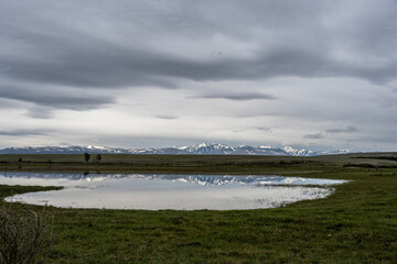 landscape of the surroundings of the village of Kosh Agach mountains with lakes and unusual landscapes in the southern regions of Altai in May