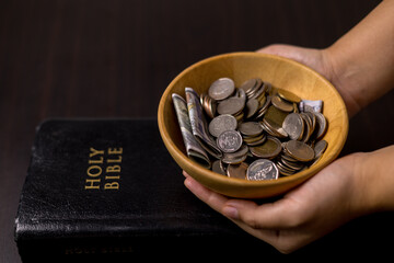 She felt deep sense of fulfillment when donating money to church, placing her tithe of coins and...