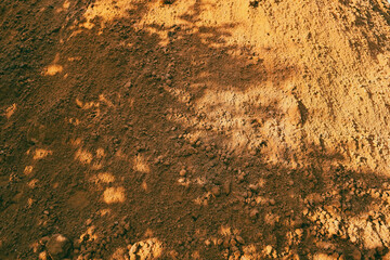 Background of brown sandy powder. Background Texture, Copy Space, Grey sand Background with abstract texture with shadows.