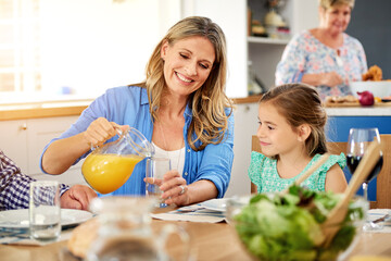 Love, orange juice or mother and daughter in house with food, meal and dining table bonding....