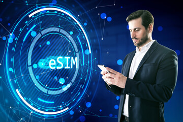A businessman using a smartphone with a futuristic eSIM technology concept on a digital background