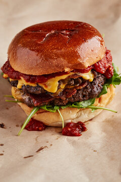 Double cheeseburger with tomato relish in a brioche bun