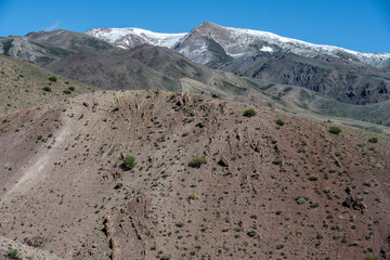 panoramic landscape with unusual red mountains with a Martian view filmed from a drone in Altai in May