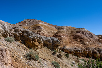 Obraz premium panoramic landscape with unusual red mountains with a Martian view filmed from a drone in Altai in May