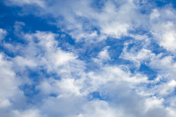 Bright sky texture background with white clouds, pleasing to the eye.