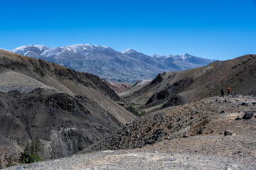 panoramic landscape with unusual red mountains with a Martian view filmed from a drone in Altai in May