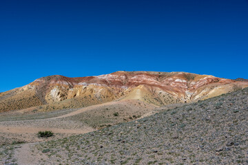 panoramic landscape with unusual red mountains with a Martian view filmed from a drone in Altai in May