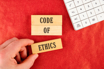 Business and code of ethics concept. Copy space. Symbol. Concept words Code of ethics on the blocks...