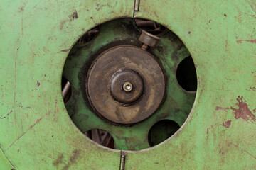 Detail of a worn, dirty and greasy industrial lathe machine.