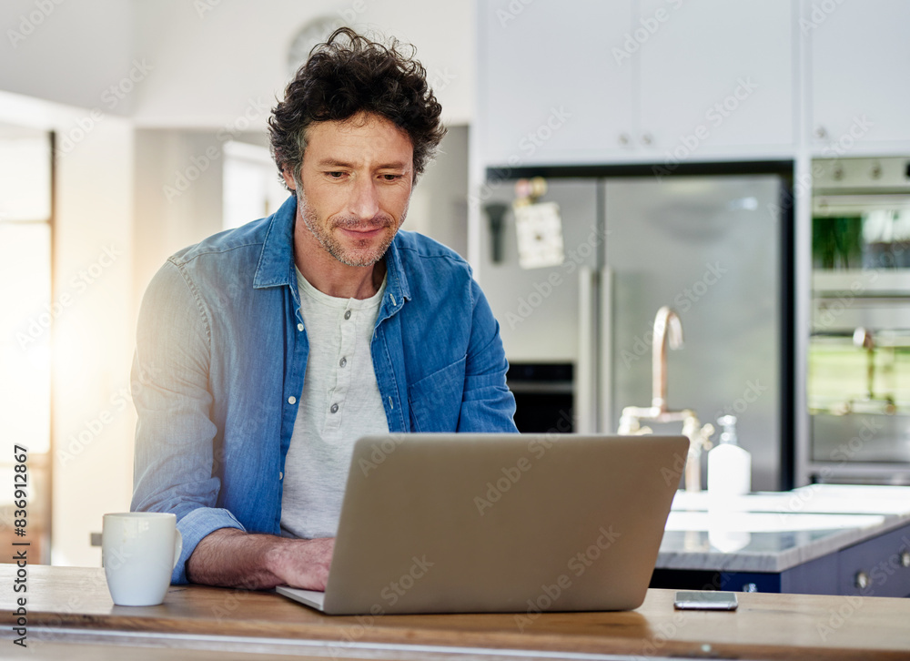 Poster man, laptop or typing in kitchen for remote work, web designer with check for schedule. male entrepr