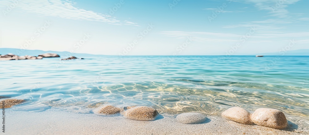 Poster Feet resting in the water on the coastline with a serene beach background and empty surrounding, perfect for a copy space image.