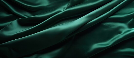 Obraz premium green velvet fabric texture used as background. Empty green fabric background of soft and smooth textile material. There is space for text.