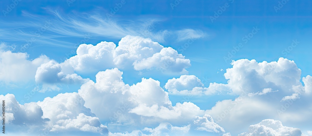 Poster Background with a blue sky and clouds, ideal for adding text or images with copy space image.