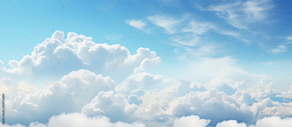 Poster Cloudy weather with cumulus clouds creates an abstract backdrop suitable for design projects with copy space image.