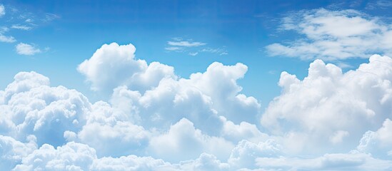 Scenic clouds in a blue sky setting with ample copy space image.