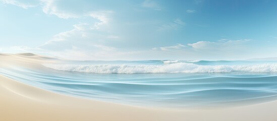 Obraz premium Gentle waves lapping the sandy shore form a tranquil scene with room for text in the image.