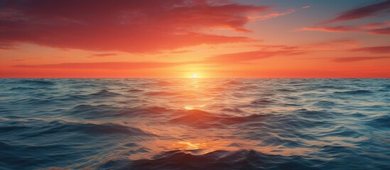 Fototapeta premium Scenic views of sunrise and sunset over the sea and ocean with a beautiful copy space image.