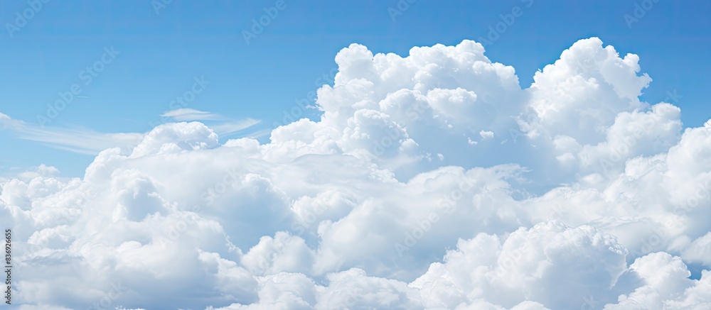 Leinwandbilder Cloudy weather with cumulus clouds creates an abstract backdrop suitable for design projects with copy space image.