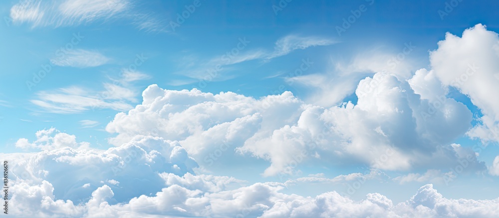 Poster Sky background with fluffy clouds providing copy space image.
