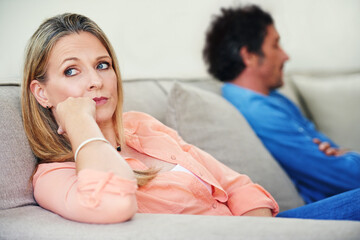 Couch, couple and fight in home for annoyed, divorce or married people for argument. Disagreement,...
