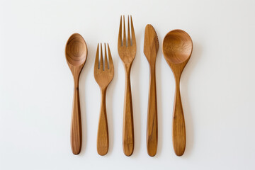 Eco-friendly wooden cutlery on a white table. Copy space