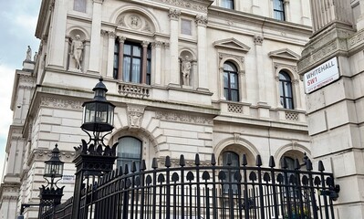 The entrance to Downing Street from Whitehall with the street name signs in view in Westminster,...