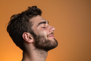 Obraz premium A close up of a man with beard and closed eyes looking to a side