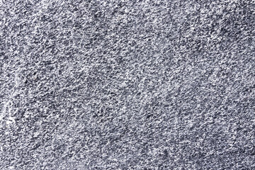 Photo of the surface of a stone wall.