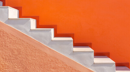 Side view of white stairs against a vibrant orange wall, creating a striking contrast and a modern architectural visual effect.