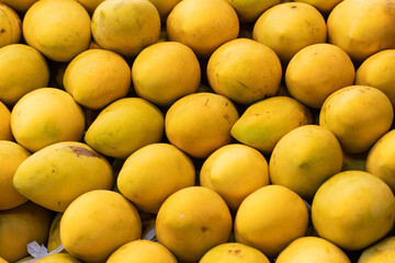 ripe yellow mango as background.