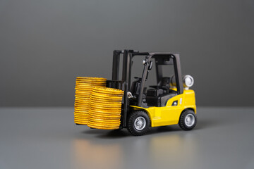Forklift and stacks of coins. Increase income in export of goods. Trade traffic increasing....
