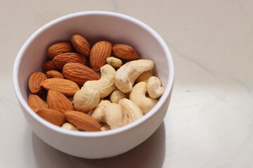 Cashews, almonds, Nuts in bowl with a copy space.