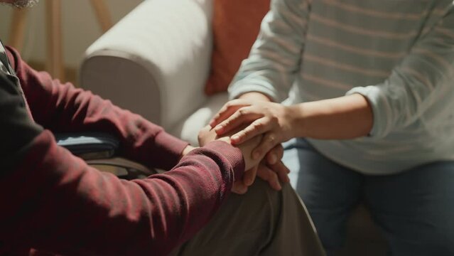 closeup old senior husband face Close up mature couple holding hands, loving caring wife supporting comforting senior aged husband, family expressing empathy and understanding, trusted relationship 