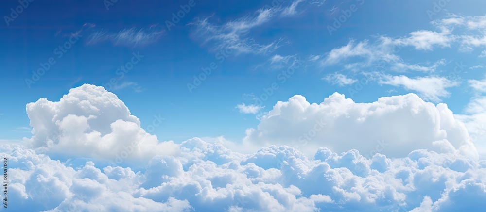 Poster blue skies filled with fluffy white clouds on a sunny day create a picturesque scene with a copy spa